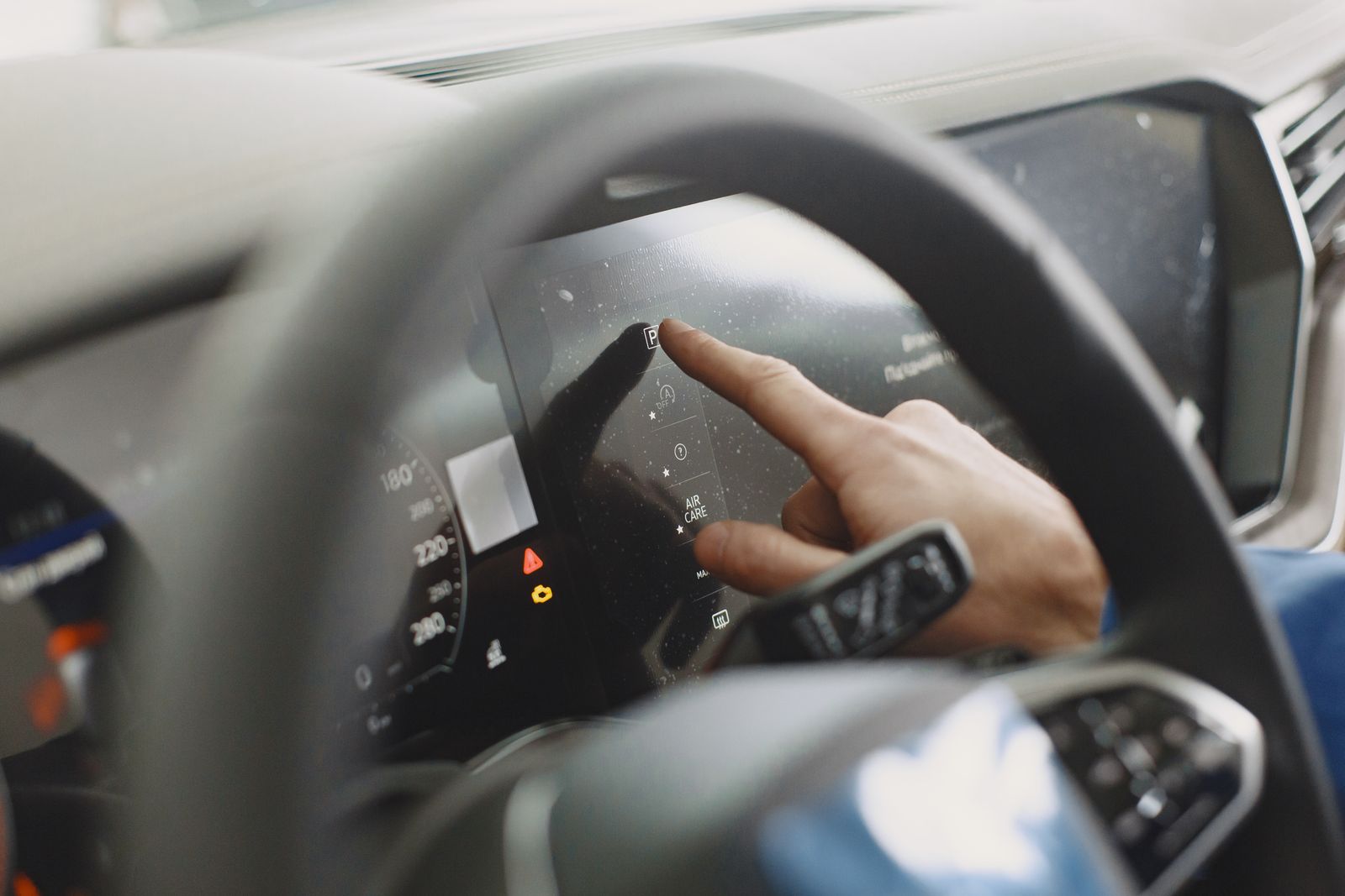 A dashboard display showing driver assistance system indicators