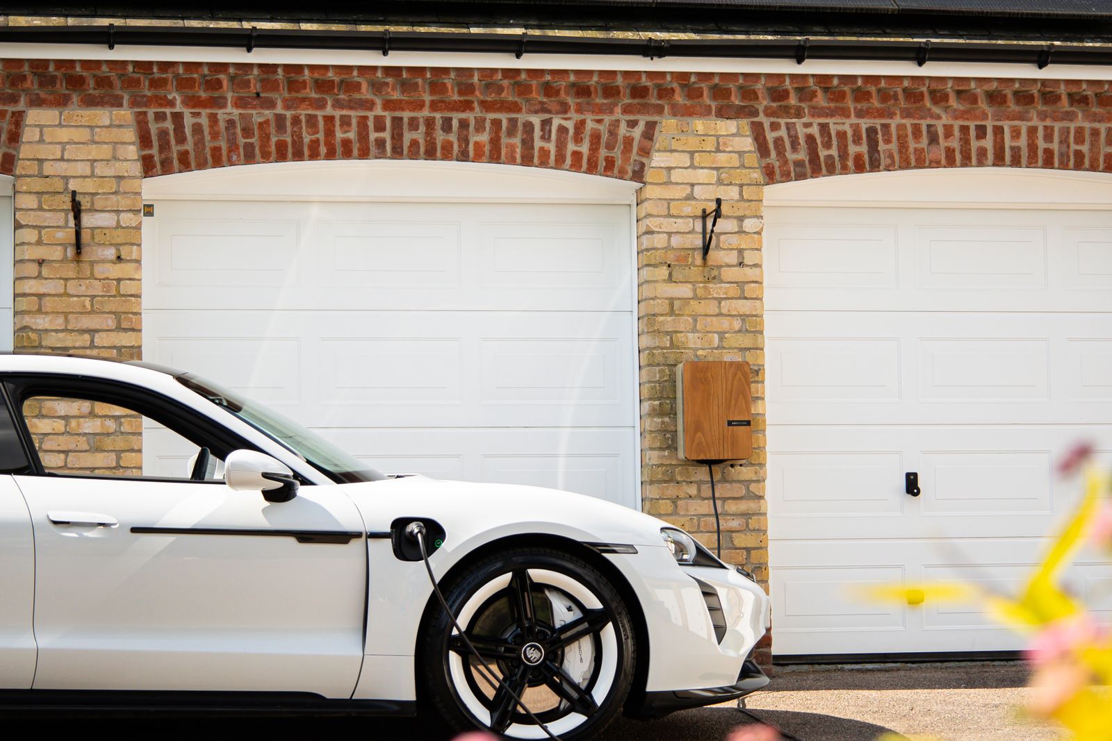 An electric vehicle charging at a home charging point