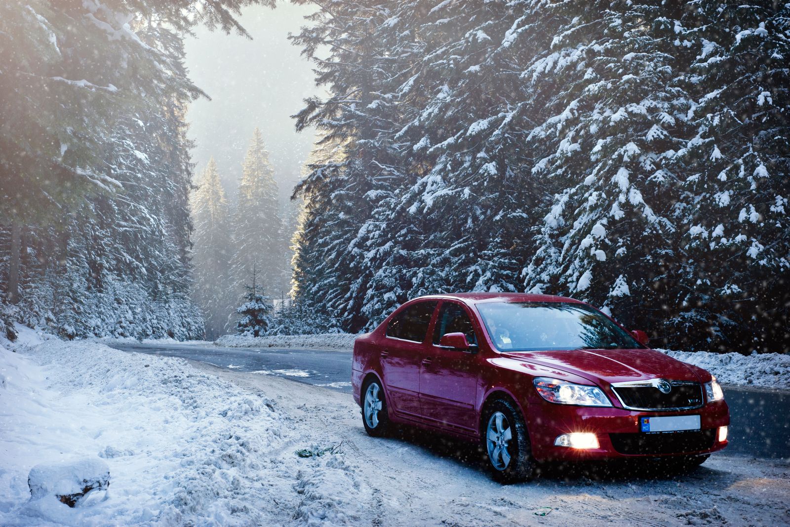 A vehicle in snowy winter driving conditions